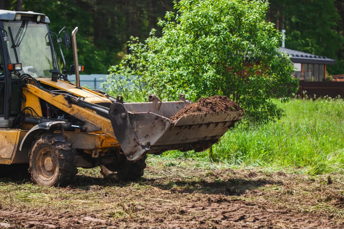Graded dirt pad after clearing